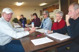 A group of volunteers is working to tabulate the results of the Cook County taxpayer survey that was sent out last month. Out of 2,142 surveys mailed, about 850 were returned. Here, Garry Gamble in the white cap and white shirt discusses the protocol used to weigh results of the individual questions. Because of the time it takes to go through each survey—and the limited time of the various people who are helping—the results of the survey won’t be known for two to three weeks. On the other side of the table from Garry, from right, are Nick Burger, Carol Burger, Tom Bradovich, Joyce Heiskari and WTIP’s Joe Friedrichs, who was overseeing the tabulations.