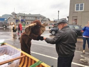 Murray the Moose hands the winning ticket to Jim Boyd, Chamber Foundation executive director.