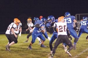 Top: Freshman Caide Northrup, carrying the football, was the first young player called into the game by head coach Mitch Dorr in the one-sided affair against the Littlefork Big Falls football team. Coach Dorr gave a lot of young players significant playing time in this Section 7A playoff game. Above left: Dillon Sjogren was off to the races on this play. Above: An arm tackle wasn’t going to take down Colton Furlong. Furlong was named the Vikings’ Offensive Player of the Game. He carried the ball six times, gaining 121 yards, and scored three touchdowns and a two-point conversion. “He played a great game and looked to be 100 percent healthy for the first time all year,” said head coach Mitch Dorr.