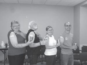 Shannon Curran, RN, clinical nurse manager, provided both the injections and the root beer to the Cook County Hospital Board at the board’s October meeting. “Jennifer Dowden, RN, Infection Control coordinator, has been encouraging our employees and board members to come and have ‘a shot and a beer,”’ said North Shore Health director Kimber Wraalstad, who noted that “more than 85 percent of our employees have received their flu shot.” Brave board members from L-R: Sharon Bloomquist, Steve Nielsen, Kay Olson and Justin Mueller.