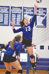 Left: Alyssa Fenstad Lashinski (13) sent this volleyball over the net with maximum velocity. Above middle: Pig-tail flying, Sophia Eliasen enthusiastically spanked the ball into the Moose Lake court. Top right: Reilly Wahlers made a great play on this low ball while Raina Ryden looked on. Above right: Meredith Sutton polished both kneepads while she dug a spiked shot off the floor.