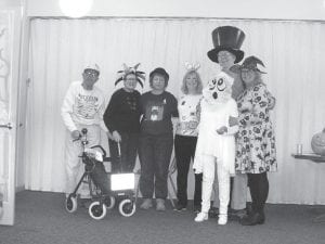 The Halloween spirit was alive and well at the Cook County Senior Center as (from left) Walt Mianowski, Geri Jensen, Therese Morrison, Kim Nelson, Betty Michaud, Tom Hedstrom and Darrellyn Barrett showed off their festive attire.