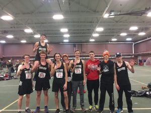 The boys’ North Shore Storm cross country team holds five fingers up to depict their fifth-place team finish at the Minnesota State cross country meet. From L-R: Noah Smith, Leif Anderson, Brenden Seipke on Anderson’s shoulders, Jake Paron, JRon Tamanaha, Issac Swanson, Will Surbaugh, J.C. Hollman and Kevin Viren.