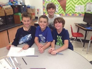 4th graders collaborate on antibullying posters, (L-R) Wyatt Blegen, Oscar Mielke, Parker Backstrom and Landon Sheils.