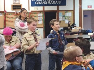 Cook County cub scouts met on Saturday, November 11 to celebrate Veterans Day and to learn about what it means to be a veteran and a patriot. Pictured here are Jake Mixdorf on the left and Noah Smith on the right. They were reciting famous Veterans Day quotes, and Jake was telling what Duty to Country and the service of our veterans means to him. They are fifth grade Webelos Scouts. Ryan Klozotsky, a veteran of Operation Iraqi Freedom, was the keynote speaker for the cub scouts Veteran’s Day celebration. He gave a presentation to the boys, told stories, showed memorabilia, and taught the boys how to care for and fold the flag. Ryan also answered a lot of the kid’s questions.