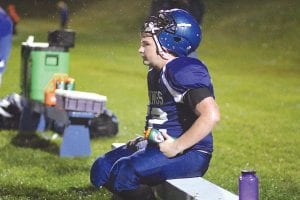 Billy Hackett takes a rest on the bench during a game. Hackett, the Viking’s top lineman, didn’t miss many plays during the season. Unless the Vikings had a big lead, the two-way player was out on the field for virtually every play.