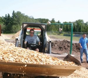 Cook County I.S.D. 166 principal Adam Nelson, seen here operating the bobcat as he and Dr. Bill DeWitt helped prepare the elementary school playground for the opening of school this August, has been offered the superintendent position at Wrenshall School District, I.S.D. 100. The offer came on Monday, November 20, when the Wrenshall school board voted to hire Mr. Nelson. Nelson has yet to submit a written resignation to the I.S.D. 166 school board, but following that, a special school board meeting will be held to discuss how the district will move forward if Mr. Nelson accepts the proposal. Wrenshall would like Mr. Nelson to start January 2, 2018.