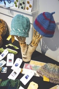 A treasure trove of hand-woven wool stocking caps and mittens was on display at the Community Center last Saturday.