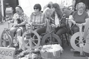 Earlier this year at North House's Wooden Boat show, these talented young ladies (pictured above) were more than happy to display their skills. Similarly, there will be plenty of spinning, weaving, felting, and knitting at the Johnson Heritage Post on Friday, December 22, but no doubt there will be plenty of weavers and spinning wheel craftspeople working their magic during the show and craft sale.