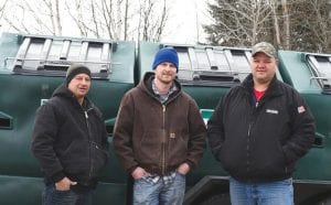 Instead of making the long drive into Grand Marais, Hovland residents now have a place where they can take a wide variety of recyclable products. Appearing at the opening of the service were, from left, Mike Smith and Rick Sturm from Cook County Recycling and Cook County District One Commissioner Bobby Deschampe.