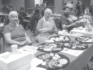 Carol Hackett and Missy Altman selling Christmas cookies at the craft sale in Grand Portage on December 2.