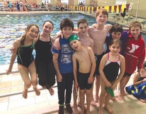 This happy group of Cook County YMCA swimmers competed recently at a large swim meet in Duluth. Front (L-R): Silas Ekstrom, Kajsa Ekstrom. Back (L-R): Olya Wright, Lexi Surbaugh, Haddon Taylor, Tristen Surbaugh, Jack Willis, Finn Taylor, Isaak Lien.