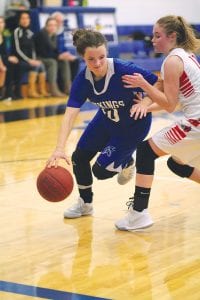 Left: Even though she was being held, Abbie Crawford dribbled around the Cromwell defender on her way to the basket. Above middle: Paisley Smith put the shot up just in time to avoid it being blocked. Above right: Blowing by the defender, Sophie Eliasen (31) took the ball to the basket for a lay-up.