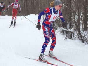 Left: Andy Kern (65) displays nice form in his first cross country ski meet of the year. The combined Two Harbors/ Silver Bay team is new, with many first-time skiers, but enthusiasm is high as the kids learn technique and get fitter through their practices. Below L-R: Lance Bartol, Linnea Henrikson, and Robin Henrikson.