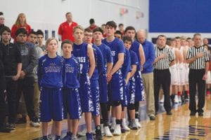 The CCHS boys’ basketball team stands for the national anthem at a recent home game. From the front to back are: Paul Dorr, Tate Crawford, Adam Dorr, Devon Premo, Pete Sutton, Will Ramberg, Keegan Morrison, Cade Northrup, and Jordan Porter.