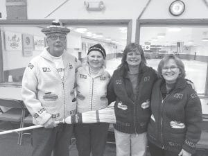 These type of hand knit sweaters were popular back in the ’70s. Left to right, Jim and Betty King along with Nancy Larson and Joanne Smith wearing their vintage sweaters. Jim is holding an old “Avenger” corn broom which was a popular broom to sweep a rock to the house with in the ’70s too.