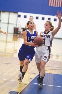 Alyssa Spry made a nice move to get around the Two Harbors defender on her way to a lay-up for two points. Spry scored five points in the contest, every one of them big as the Vikings only won by two points.