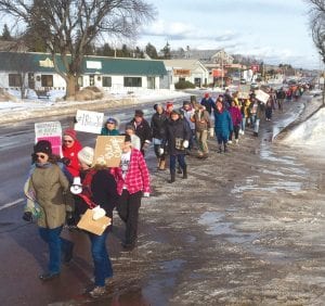 Walking two-by-two or three-by-three, many wielding signs, women, men and children took up more than one block of downtown Grand Marais in their peaceful march for Women’s Rights last Saturday, January 20.