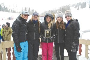 Above: Champions once again are the Viking girls’ ski team who took top honors at their home meet held at Lutsen Mountains. From left, Hazel Oberholtzer, Halle Lamb, Reilly Wahlers, Elsa Lunde and Sela Backstrom proudly pose with their first-place plaque. Left: Halle Lamb sets up to block at a gate on Koo-Koo.