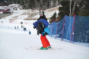 Team Manager Caleb Phillips is coach’s right-hand man—he is behind the scenes helping at the start ramp, course work and whatever is asked of him.