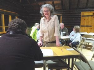 Cook County GOP Chairman Mary Petz distributed literature at the GOP caucus that was held Tuesday, Feb. 6 at the little log building at the Cook County Community Center. Only 20 people attended, enough to get a lot of business done.