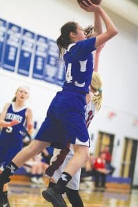 Super Woman isn’t the only one who can fly. Far left: Ariana Poyirier goes up, up and away on her two-point shot against Chisholm. Above: Alyssa Spry (4) made a nifty move around the Bluestreak defender. Left: Emma Gesch dribbled into the lane to get a good shot.