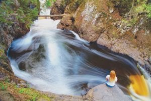 As this young lady sits on a jutting rock overlooking the river, longtime Lutsen photographer Scott Benson took this stunning summer photograph of water cascading through a series of large and small falls using a time-lapse photography technique. Benson earned honorable mention in the People/Humor category of the prestigious Lake Superior Magazine photo contest.