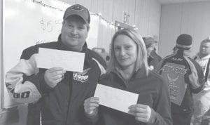 Nathan Sheils and Kali Blomberg show their envelopes containing the money they won in the drawing at the annual Cook County Ridge Riders Fun Run held Saturday, Feb. 3. Turnout for the Fun Run was good despite the nippy temperatures.