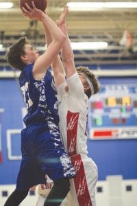 Jordan Porter was “hard pressed” to get this shot off, but shoot it he did and despite his Rebel defender’s best attempts to mug Mr. Porter, the ball went into the basket for two of the five points he scored against MLWR.