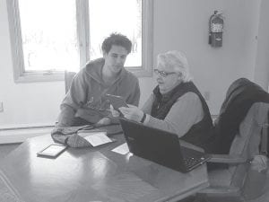 Jean Bushman gets some much-needed help from David Blackburn about her computerized devices.