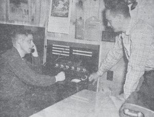 George Nelson Jr., left, of Lutsen Resort and Paul Larson, manager of the local telephone company, try out the new switchboard after its Jan. 28, 1960 installation at Lutsen Resort. The new system allowed all guests at the resort to have telephone service, and also enabled employees to have complete telephone service for the entire operation from the ski chalet to the resort. Lutsen Resort was the first resort in this area to have this type of service.