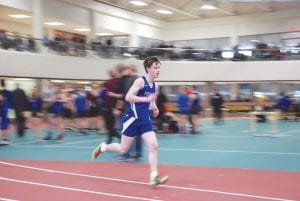 Above: Looking strong, Kevin Viren finished the mile in 5:30, a personal best for the talented freshman. Right: Malin Anderson ran a strong 800-meter leg for the girls' 4x800 relay team, clocking a personal best 2:58 for her half-mile.