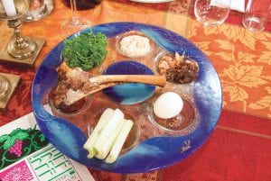 On the first night of Passover, a traditional meal called Seder is held. Pictured here is a Seder plate including symbolic foods. In Christianity, the Last Supper was a Seder.