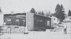 This May 20, 1991 photo shows expansion and remodeling work on the old building which housed the Grand Marais post office for nearly 40 years. The building was expanded to the east and north in order to accommodate the Arrowhead Pharmacy, which still occupies the site on the corner of Highway 61 and First Avenue West.