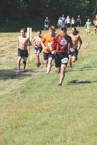 Grand Marais Mayor Jay Arrowsmith DeCoux (118), shown competing in a local race, voted in favor, along with the rest of the city council, of allowing the Voyage North 5k/10k to use city streets for the upcoming June running races. At the meeting Arrowsmith DeCoux expressed interest in running in either the 5k or 10k event if his schedule would allow.