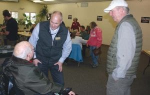 Republican congressional 8th District candidate Pete Stauber paid a visit to Grand Marais this past week to meet with local Republicans in an attempt to drum up more support for his campaign. Above, Mr. Stauber talked with Gene Glader while Garry Gamble (wearing a cap) waited for a chance to speak with the candidate.