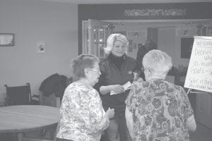 Cook County Emergency Management director Valerie Marasco talked with residents of Sawtooth Ridges Apartments following the meeting she led to discuss some confusion over a recent problem with an evacuation at the apartments.