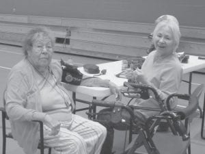 Above: Jim Spry walking/ running at the Grand Portage Community Center during the weekly Wisdom Steps walk. Left: Ellen Olson walking during the Wisdom Steps weekly walk. Top: Elder Doris Blank getting her blood pressure checked by retired nurse Vivian Carlson at the weekly Wisdom Steps walk.