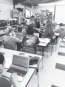 Thanks to a Lioness grant, 8th-grade students in Susan Nelson’s language arts class hone their grammar skills using IXL computer tutorials. Today’s lesson: comma use when confronted with appositives, conjunctions, independent clauses, and dependent clauses.