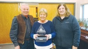 Receiving the Outstanding Career Recognition Award was Nancy Koss who is flanked by her husband Clayton and Kelly (Johnson) Roberts.