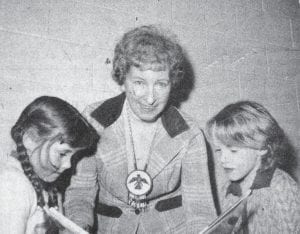 Mrs. Virginia Wegsten was honored on Jan. 24, 1974 by the Birch Grove PTA for her years of dedication to the Birch Grove children. Heidi Hanson, left, and Kary Lin Klose are shown admiring the book Superior that was presented to the former teacher at the affair. Mrs. Wegsten retired from teaching in the fall of 1973 after serving many years as the school’s principal and teacher.