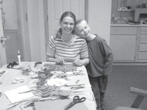 The recent fairy garden project at the Cook County Senior Center drew a nice crowd. Above, Sherri and Christian Lashinski are just finishing up on their fairy garden undertaking. Now they must wait to see if any fairies take flight and alight in their garden.