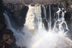 With all of the spring melt from snow and recent rainfall the torrent of water crashing over High Falls in Grand Portage State Park on the Pigeon River is spectacular right now. On a sunny day the rainbow across the falls is something to behold. It’s only a short walk in to the falls, with stops along the way if you need them. The path is paved for the most part and signs guide you to the middle falls or to the high falls, which at 120 feet is the highest waterfall in Minnesota.