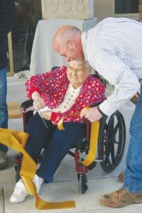 While there was a gaggle of big shots who helped cut the ceremonial ribbon commemorating the rededication of the North Shore Health facility on May 17, the sweetest scissor wielder of all was North Shore care center resident Bernice LeGarde, president of the Resident Council, who needed a little assistance from Clayton Wrazidlo, Boldt superintendent.