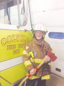 Kim Linnell is dressed in his fire gear and ready for action. The longtime volunteer said he was inspired to become a volunteer firefighter to give back to his community.