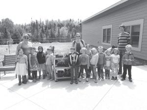 A fun afternoon was had on May 29th when the “bear cubs” (kindergarteners) from GES came bearing flowers that they had grown to plant in our patio flower boxes.