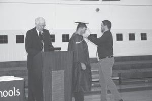 Kris Hoffman put a tassel around Wyatt Baker’s neck as Lake Superior College representative Jim Schwarzbauer announces to the crowd that Wyatt had earned a 30-credit welder’s certificate from Lake Superior College.