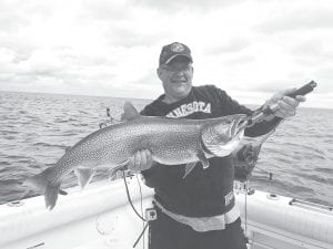 Matt Monson, North Branch, caught this 20.38-pound lake trout on June 3, when he was fishing aboard Tofte Charters with Capt. Darren Peck.