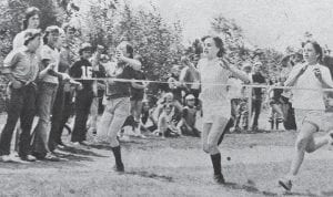 Breaking the tape in the 50-yard dash at Birch Grove Elementary School in June 1975 is Mary Banks, 11, a student at the Tofte school. In the center is Kelly Scheffler from Birch Grove and Misty Johnson from Sawtooth Elementary. The children were participating in the annual Track and Field Day held for all of the students in the Cook County School District.