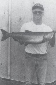 Dale Mielke of Grand Marais displays the 16-pound chinook salmon he caught on Aug. 28, 1983 near the mouth of the Cascade River in Lake Superior. Mielke said he also caught a 10-pounder the day before at the same location.